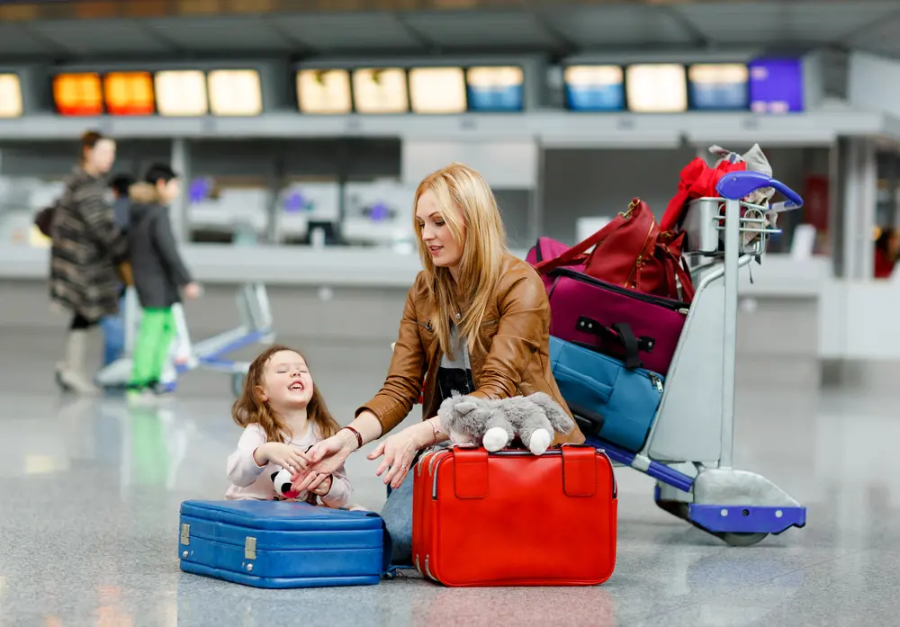 Image of parent and child in airport, dealing with travel anxiety in kids
